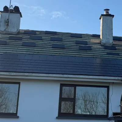 Finished slate roof on a white rendered house, Global Roofing and Guttering, Dublin