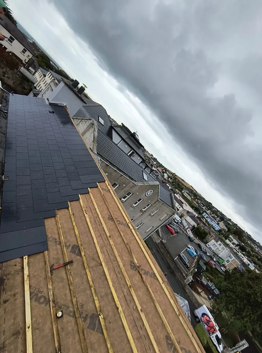 Slate re-roof half finished, new slates going on over membrane and battens, Global Roofing and Guttering, Dublin